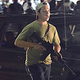 In this Tuesday, Aug. 25, 2020 file photo, Kyle Rittenhouse carries a weapon as he walks along Sheridan Road in Kenosha, Wis., during a night of unrest following the weekend police shooting of Jacob Blake.